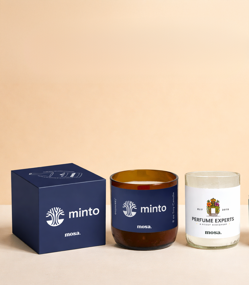 Two custom made candles with 'minto' branding and a box on a beige background