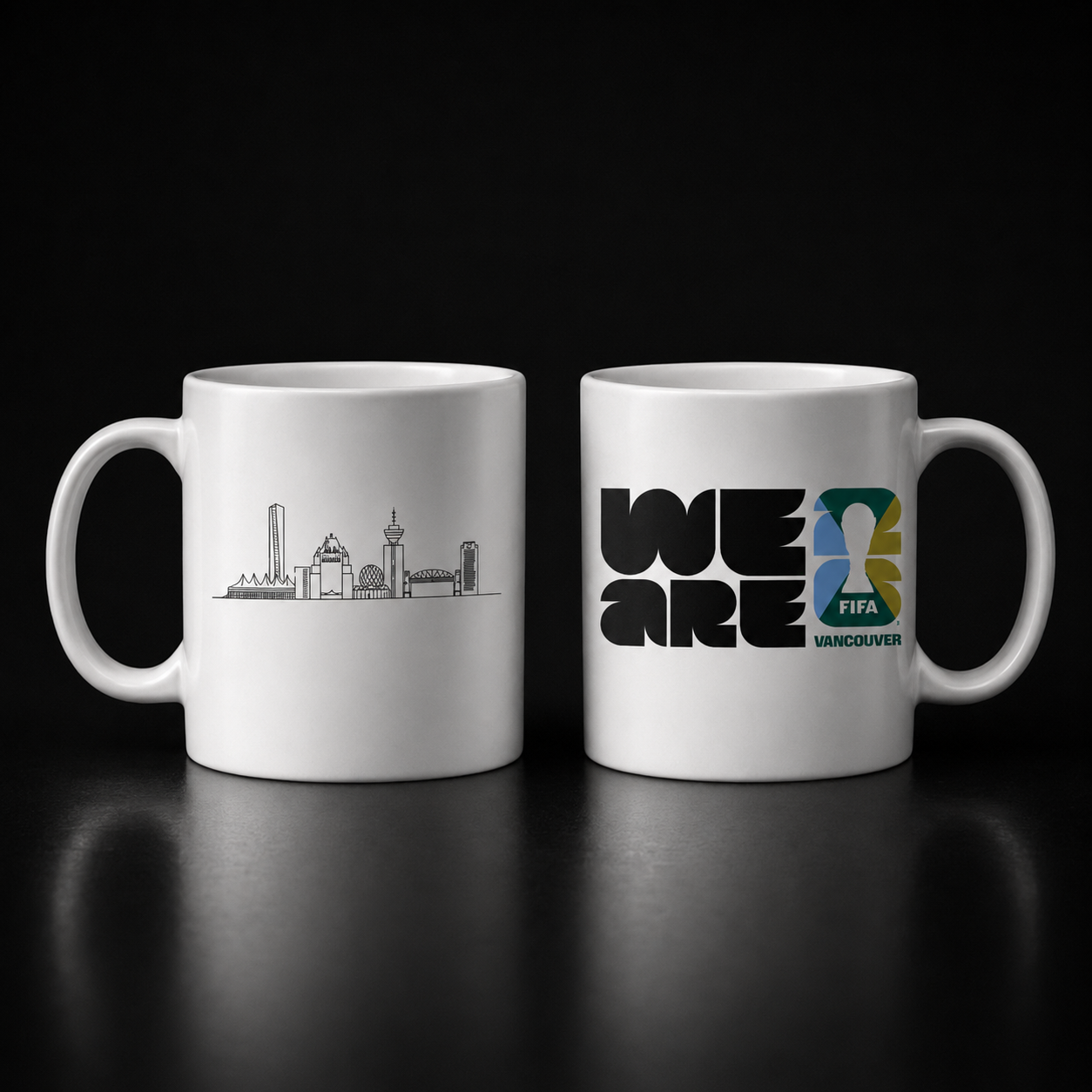 Two white mugs with FIFA World Cup designs on a black background