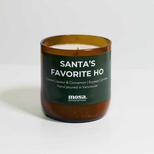 Sustainable gifts made with recyclable glassware, creme liqueur and cinnamon Christmas candle