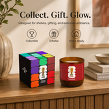 Candle and packaging with FIFA branding on a wooden surface.
