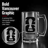 Empty glass mug with FIFA Vancouver design on a black background