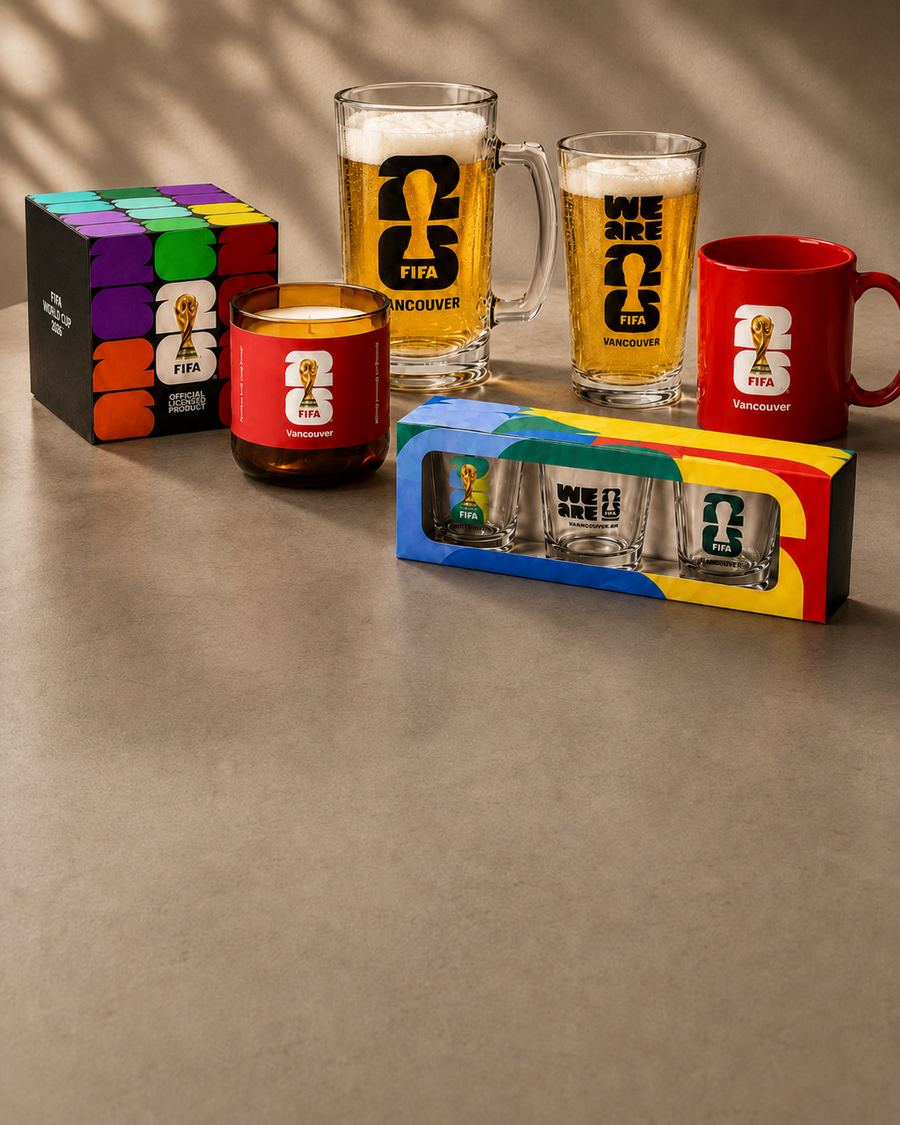 FIFA 2026 themed glasses and mugs on a gray surface with a colorful box
