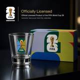 FIFA World Cup 26 officially licensed product with glass and box on a dark background