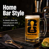 Glass mug with 'FIFA Vancouver' logo filled with beer on a Home bar setting.