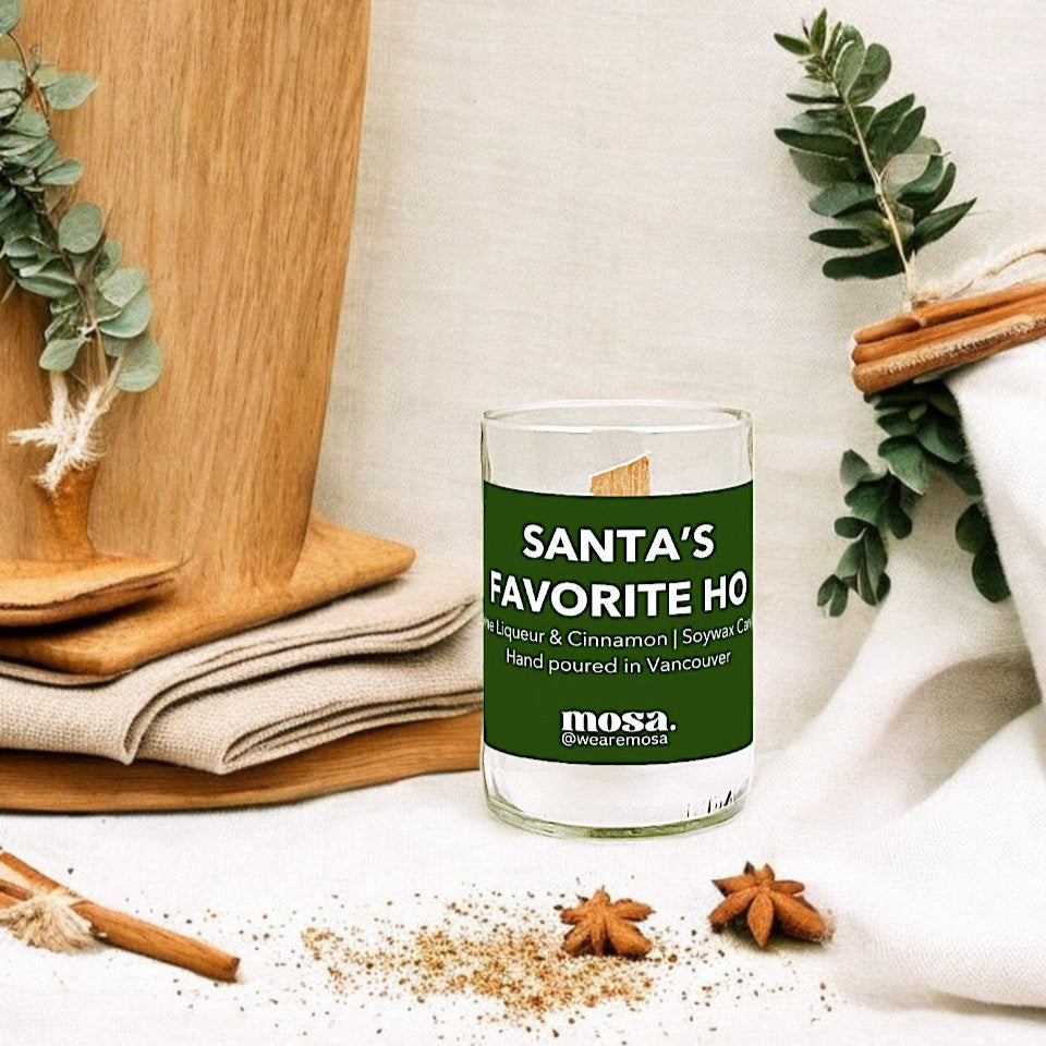 Sustainable gifts made with recyclable glassware, creme liqueur and cinnamon Christmas candle