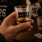 Person holding a shot glass with 'We Are FIFA' logo at a sports event, with text 'Made for Match Night' and 'Vancouver Host City energy'.