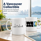 Two mugs with FIFA Vancouver-themed designs on a table with a cityscape background