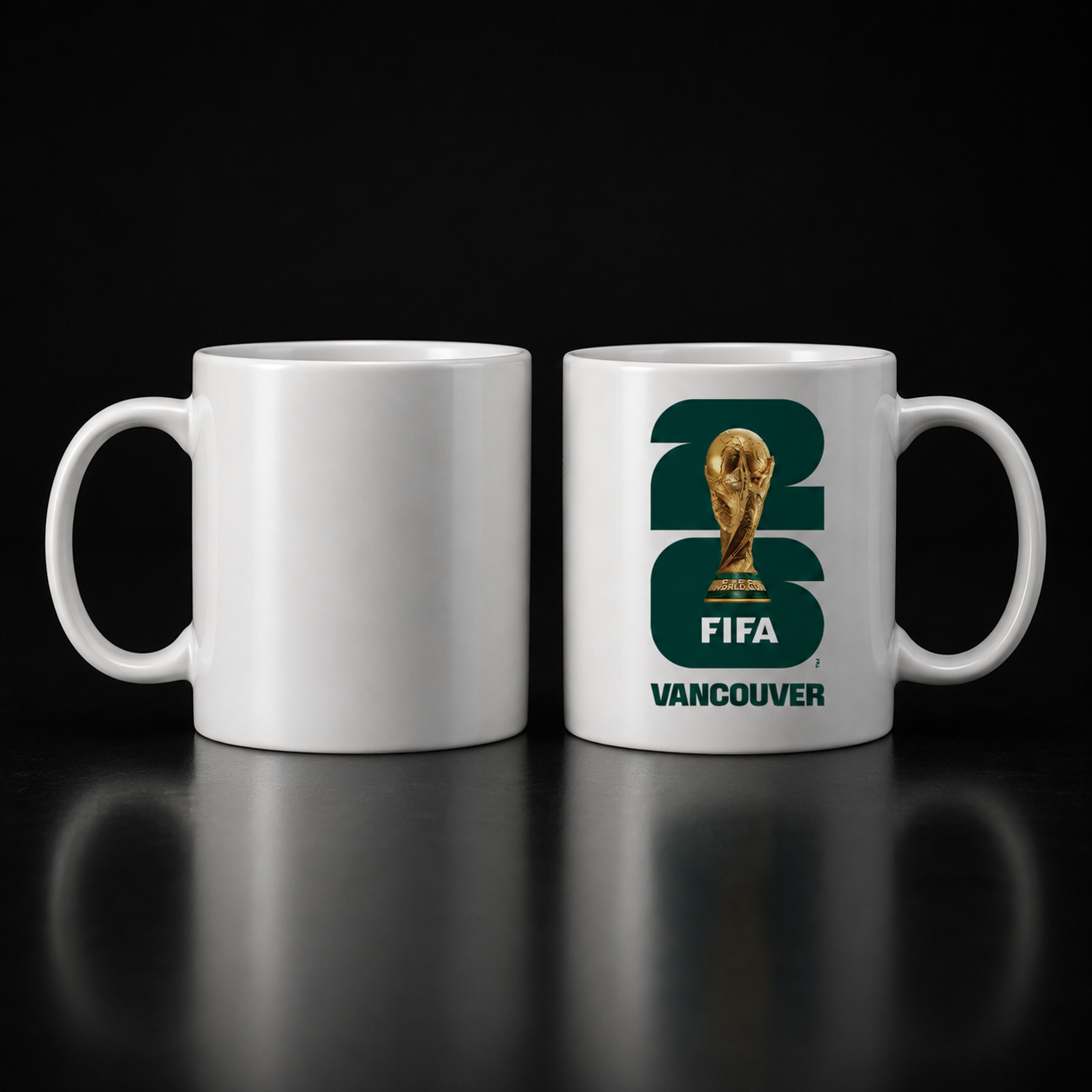Two white mugs, one plain and one with FIFA Vancouver 2026 logo featuring a trophy.