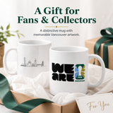 Two white mugs with Vancouver-themed designs on a gift box with ribbons.